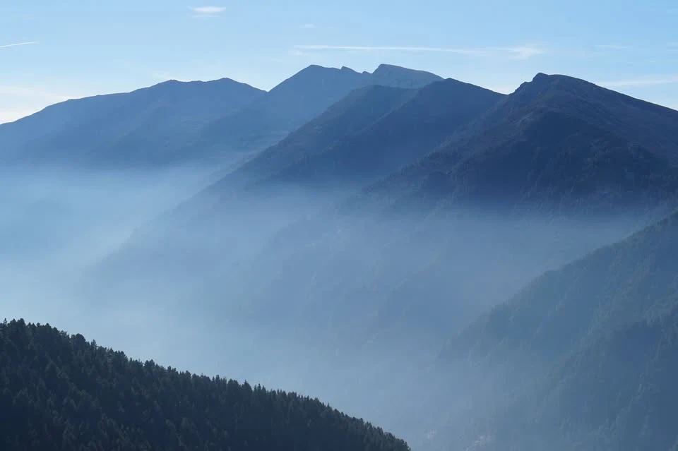 Mountain ridges silhouetted in blue haze
